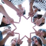 group-of-people-forming-star-using-their-hands-1116302